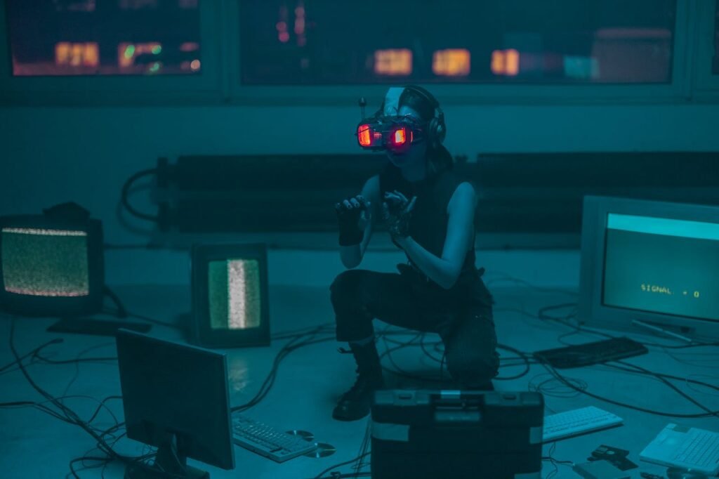 A woman crouching with VR headset in a sci-fi room filled with digital screens.